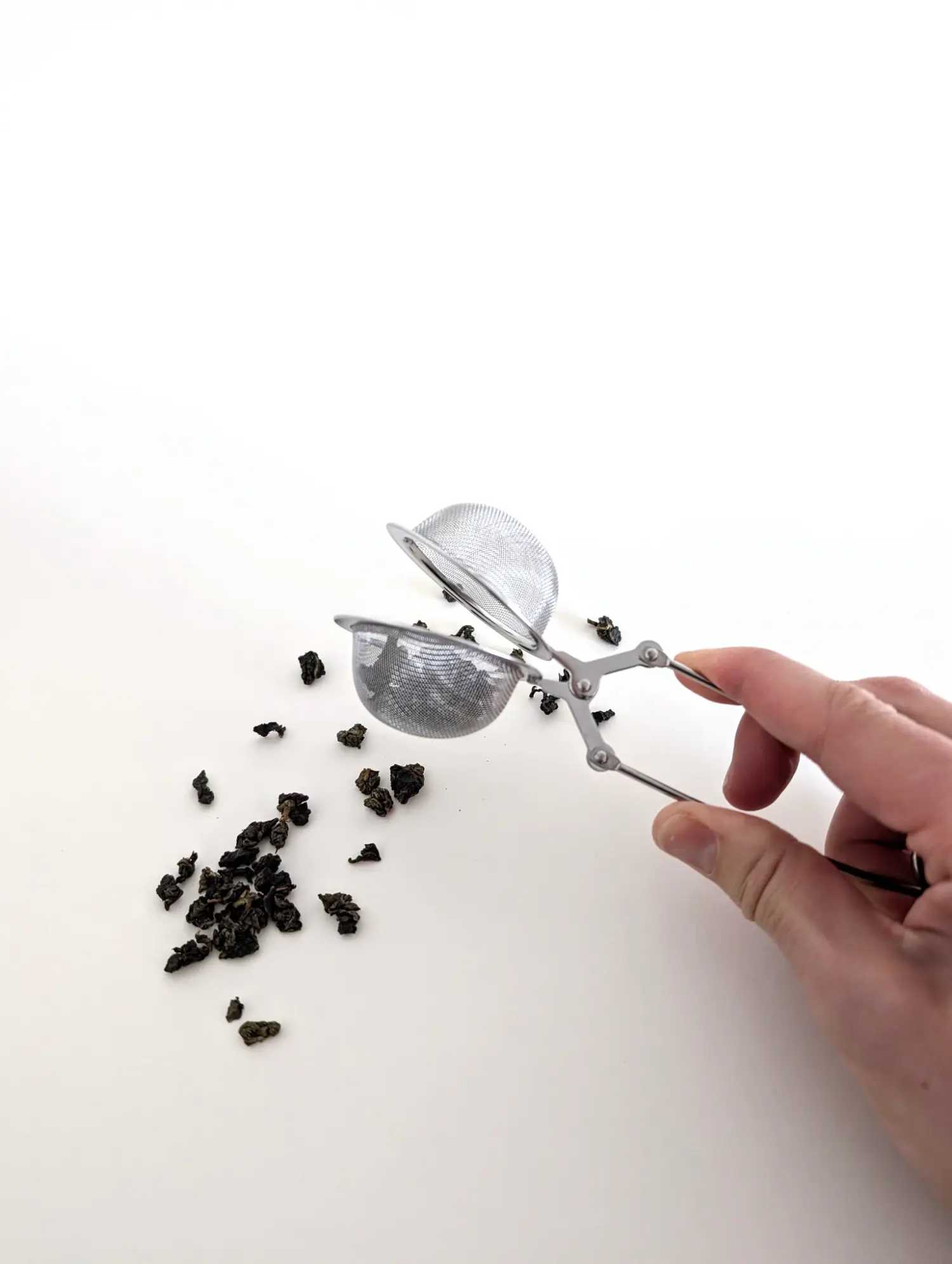 Infusore per tè in foglie a pinza in acciaio