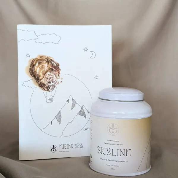 Erinora customizable Inspire gift box containing organic loose-leaf tea tin and recycled paper notebook with artistic cover illustration