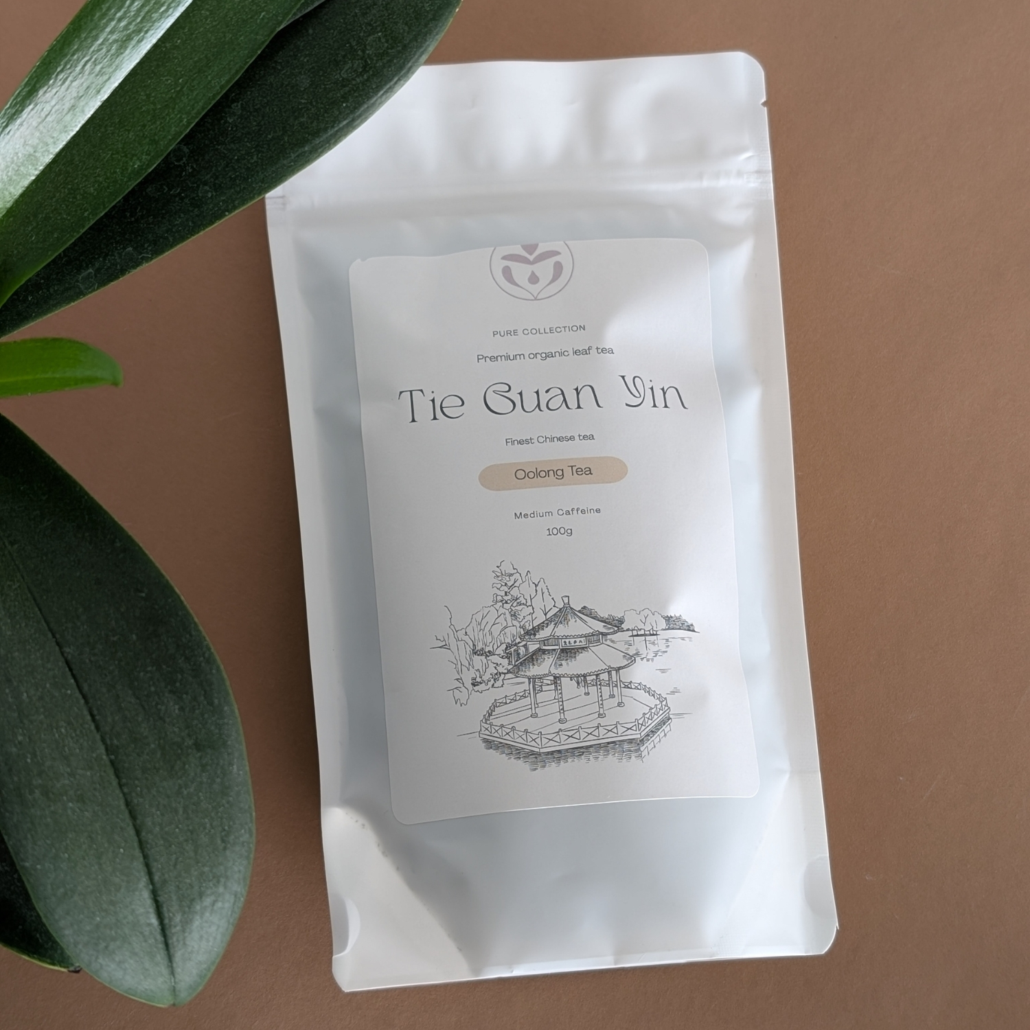 Organic Tie Guan Yin oolong tea packaging styled on table